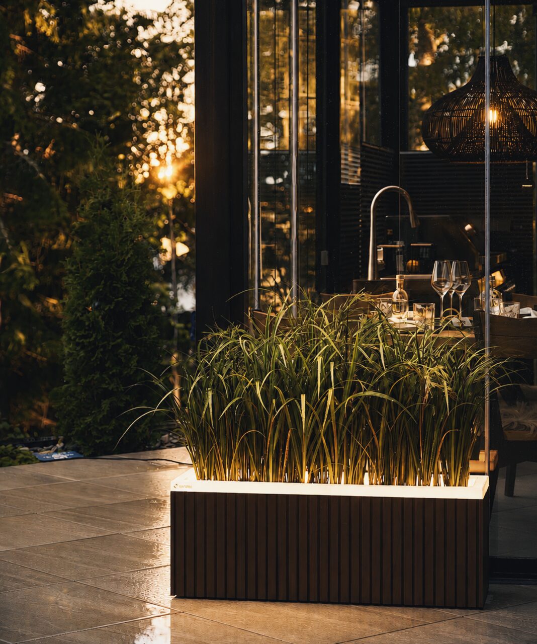 Light-finished Nemea planters on the terrace at Villa Sydän